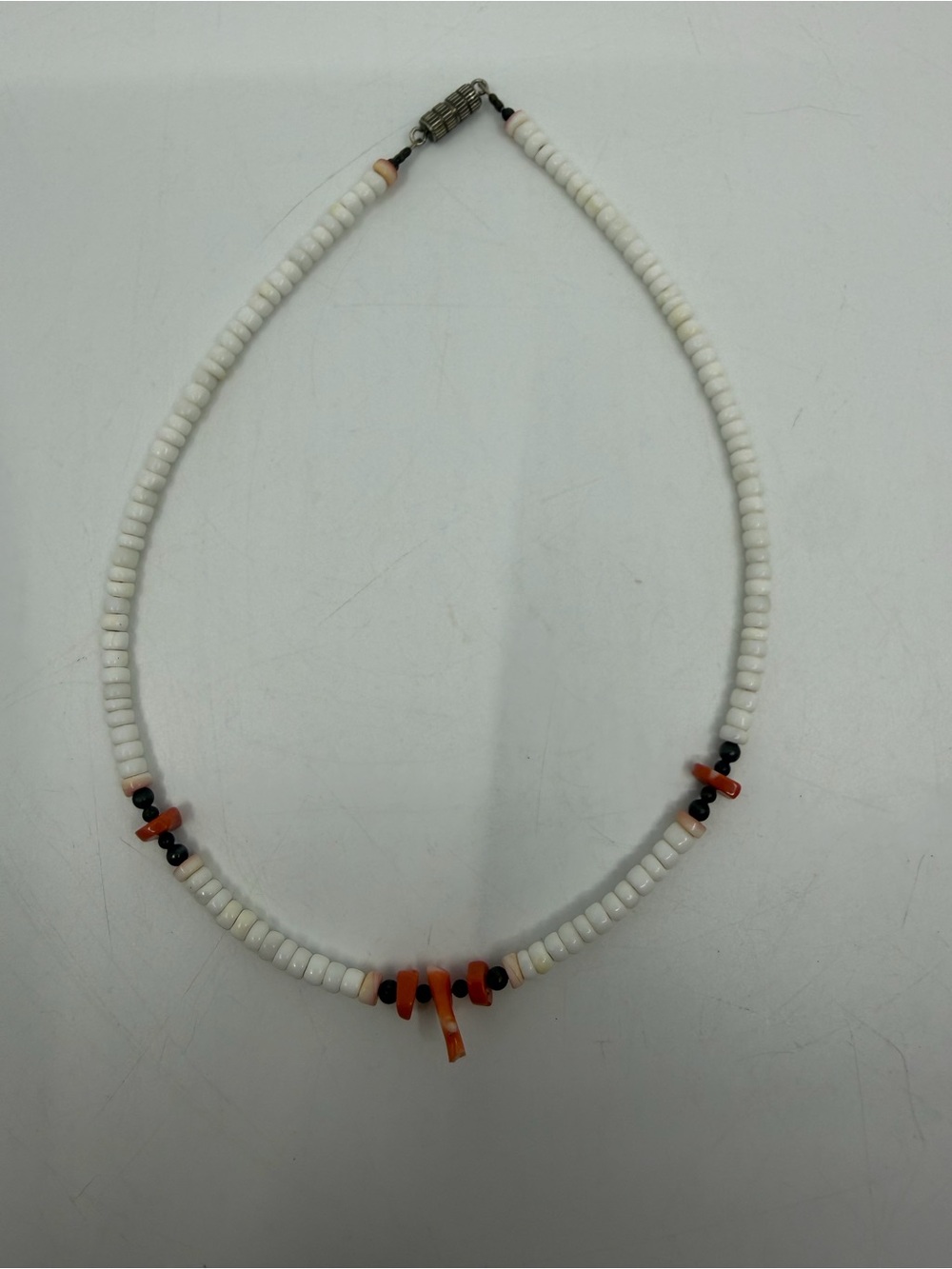 White Beaded Necklace with Orange Accents